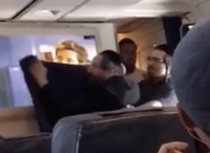 VIDEO: Hasidic Jews cheer as they cover up a screen showing in-flight movie | Secret Flying
