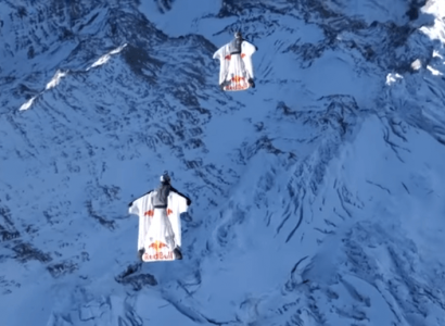 VIDEO: Two wingsuit flyers jump from top of mountain into a flying plane | Secret Flying