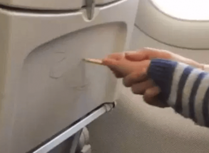 VIDEO: Parent helps her child graffiti on plane seats | Secret Flying