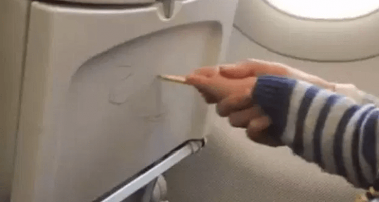 VIDEO: Parent helps her child graffiti on plane seats | Secret Flying