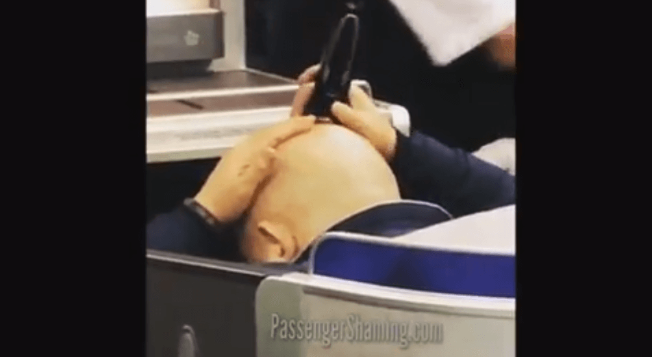 VIDEO: United Airlines passenger shamed for shaving his head in his seat