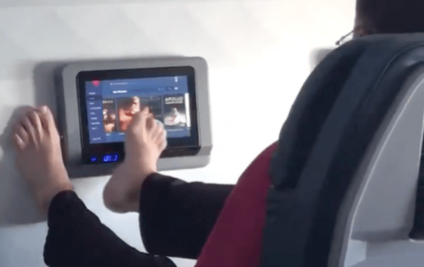 VIDEO: Disgust as airline passenger uses bare feet to swipe touch-screen TV