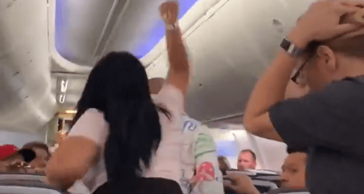 VIDEO: Woman smashes laptop on boyfriend’s head for looking at another woman on American Airlines flight | Secret Flying