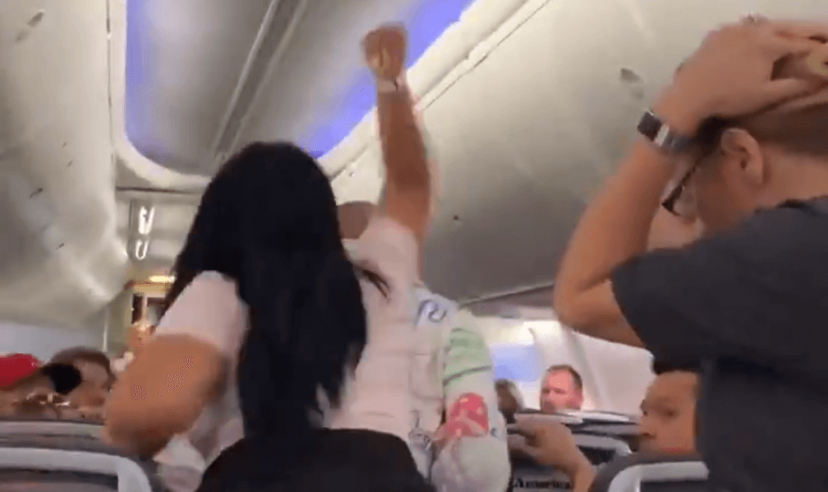 VIDEO: Woman smashes laptop on boyfriend’s head for looking at another woman on American Airlines flight