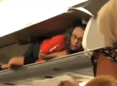 Strange moment a Southwest flight attendant greets passengers from inside an overhead locker | Secret Flying
