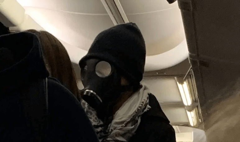 Man kicked off American Airlines flight for wearing gas mask