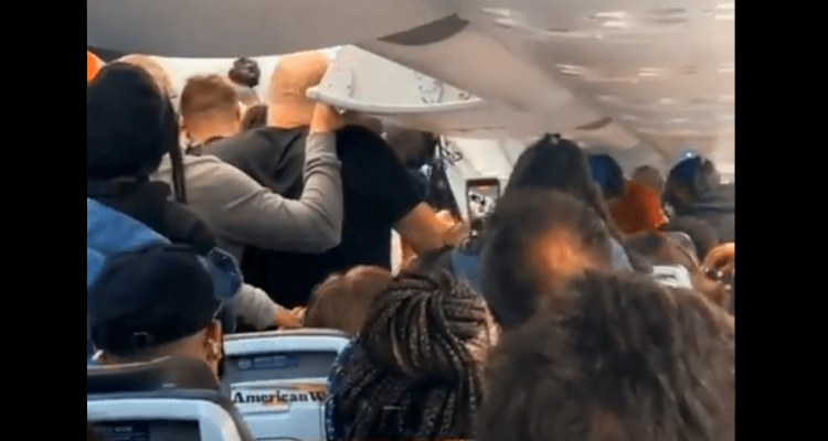 VIDEO: American Airlines passengers fight over who gets off plane first | Secret Flying