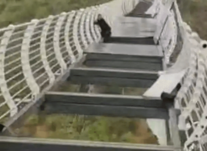 Glass panels on Chinese bridge fall out leaving tourist clinging for life | Secret Flying
