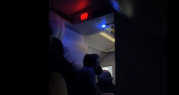 VIDEO: Off-duty Delta flight attendant attempts to open door leading to chaos | Secret Flying