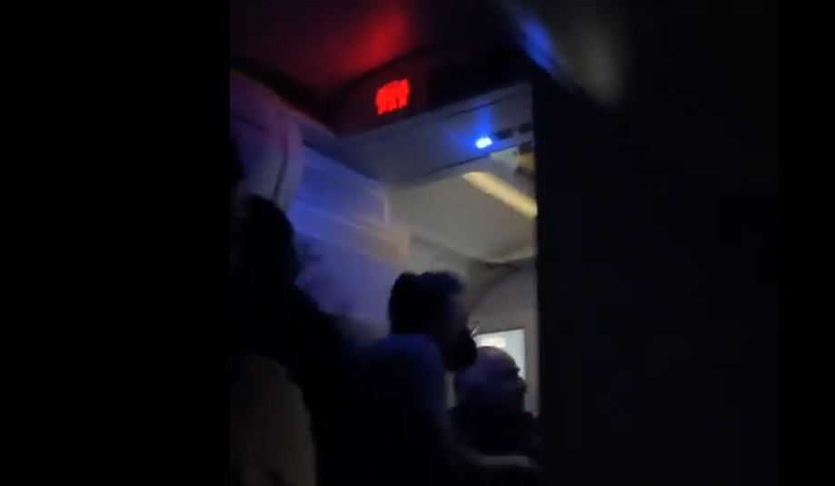 VIDEO: Off-duty Delta flight attendant attempts to open door leading to chaos
