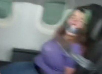 VIDEO: Woman duct-taped to seat after biting American Airlines flight attendant | Secret Flying