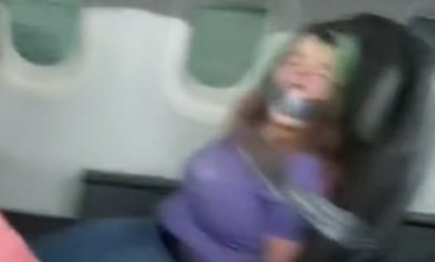 VIDEO: Woman duct-taped to seat after biting American Airlines flight attendant | Secret Flying