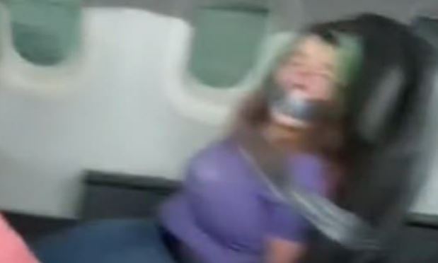 VIDEO: Woman duct-taped to seat after biting American Airlines flight attendant | Secret Flying VIDEO: Woman duct-taped to seat after biting American Airlines flight attendant | Secret Flying