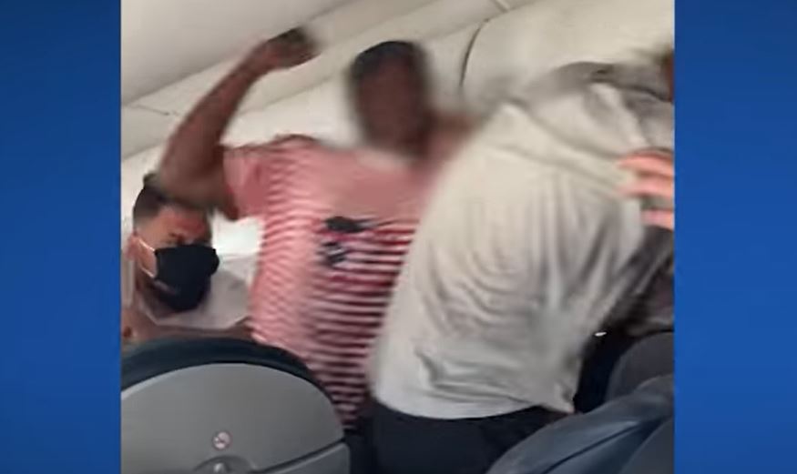 VIDEO: American Airlines passengers brawl over a reclined seat that got stuck