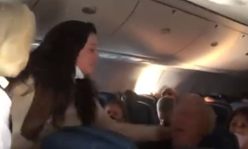 VIDEO: Former NFL cheerleader arrested on Delta flight after punching and spitting on man over facemask