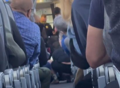 American flight attendant hits passenger over the head with coffee pot as he tries to open plane door | Secret Flying