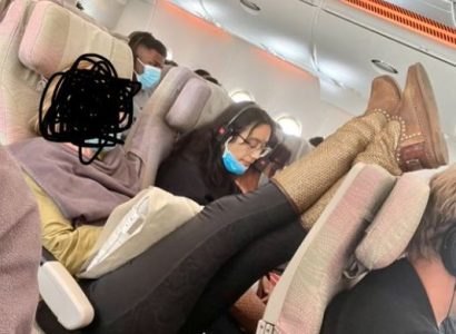Internet divided after woman pictured putting her feet up on fellow passenger’s seat | Secret Flying
